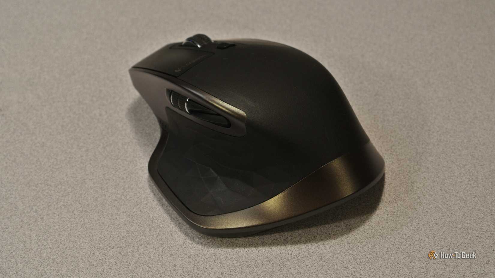 The Logitech MX Master original ergonomic mouse sitting on a desk.