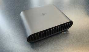 TP-Link AX3000 travel router on a table.
