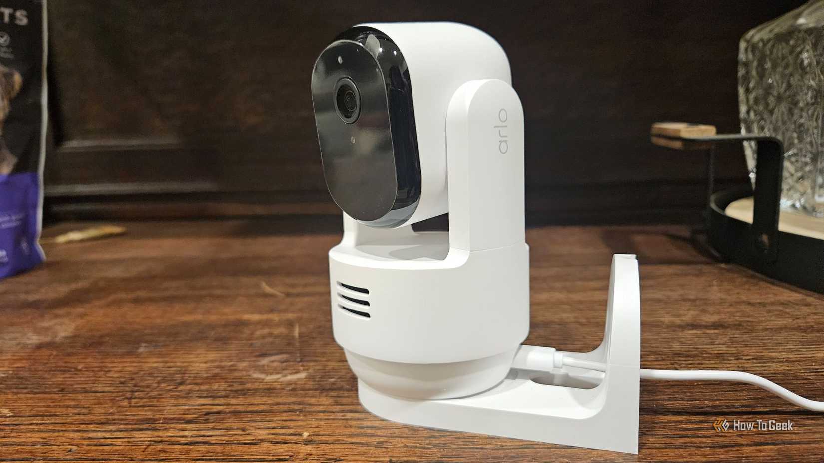An Arlo indoor security camera on a table.