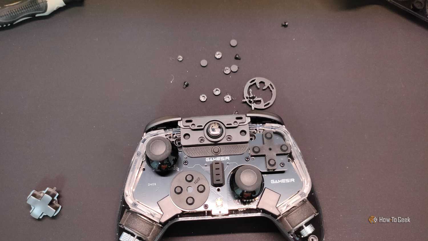 A disassembled GameSir Cyclone 2 Controller with some 3D printed parts.