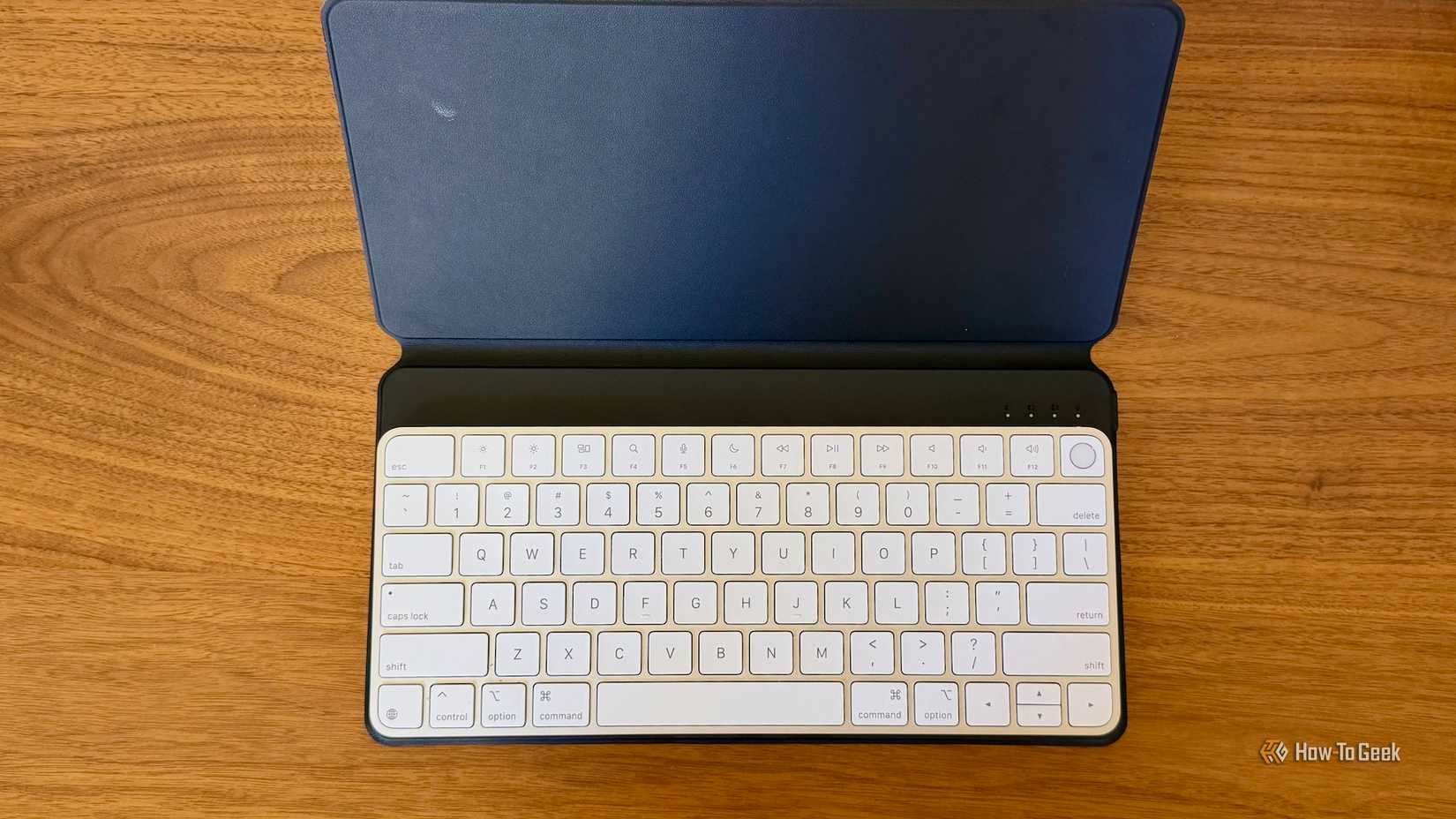 Satechi OntheGo Keyboard with Stand with an Apple Magic Keyboard on top of it.