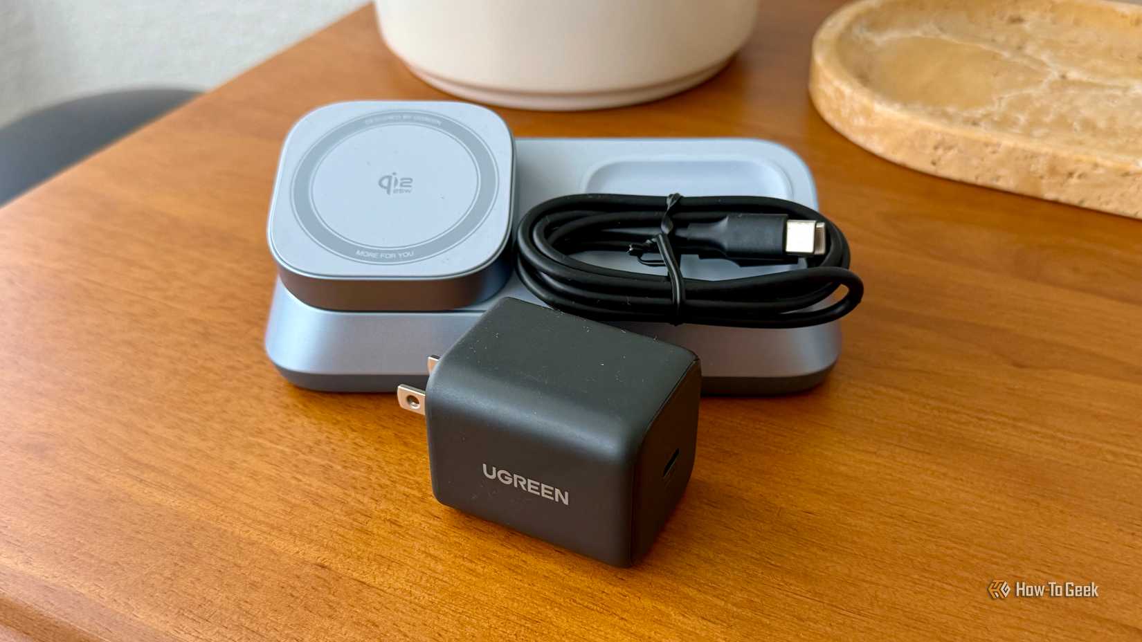 Ugreen MagFlow 3-in-1 Magnetic Wireless Charger with its large charger.