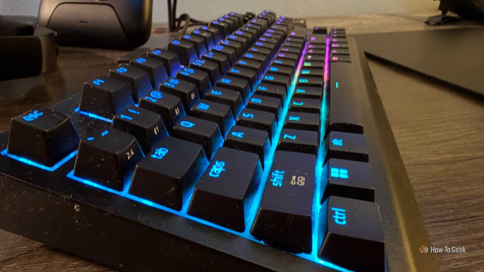 The Razer BlackWidow V4 Tenkeyless Hyperspeed from the side with RGB on.