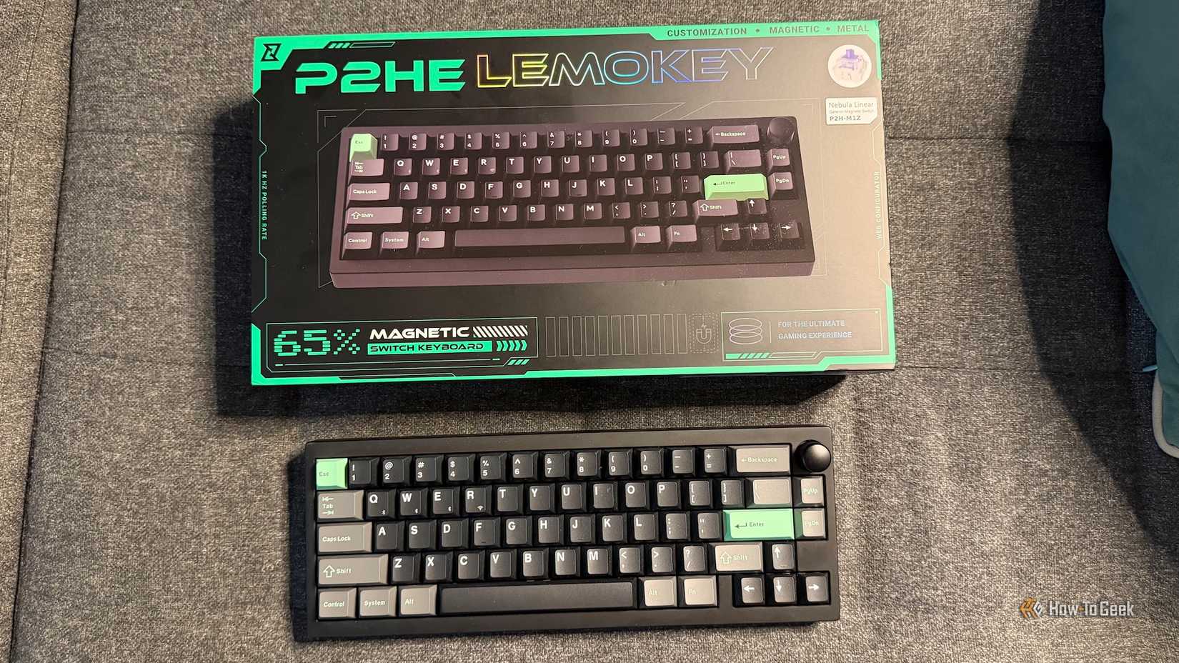 The Lemokey P2 HE and its box on a couch.
