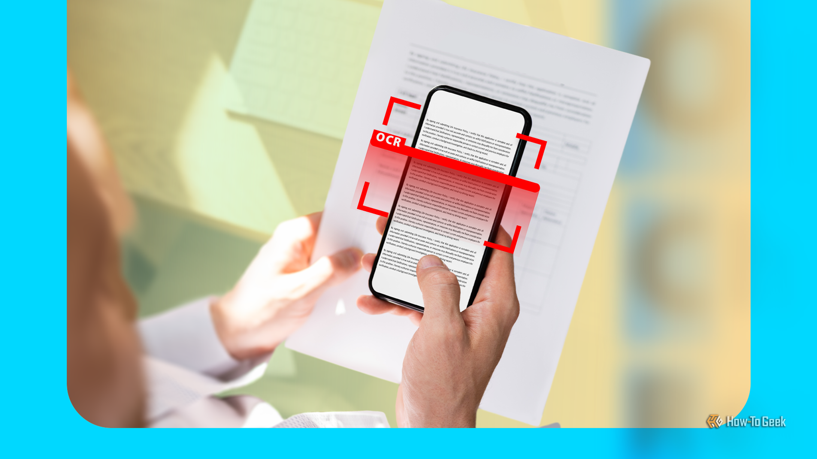 Person holding a document while scanning text with a smartphone, highlighted by a red scanning overlay.