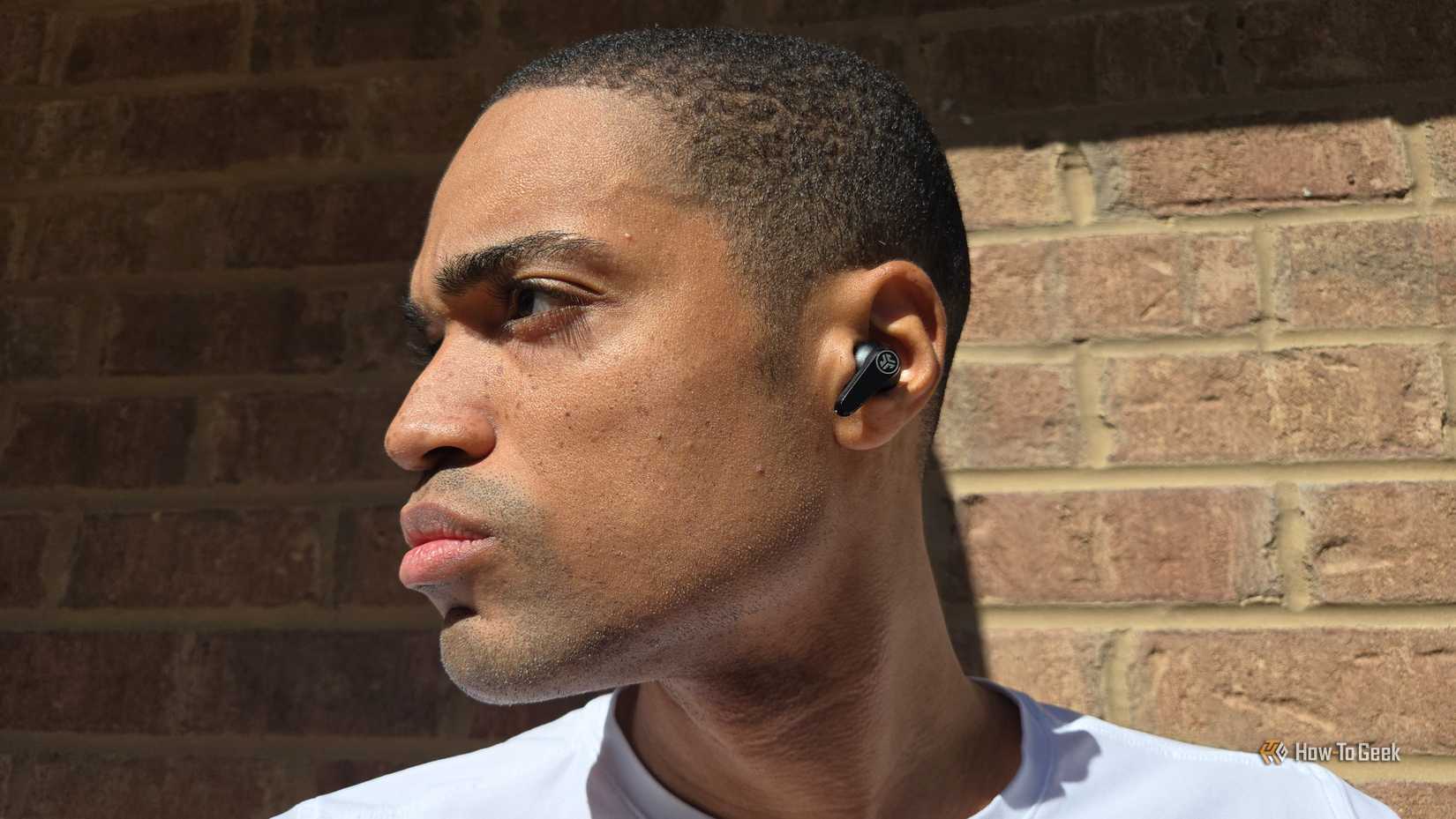 Person wearing JLab GO Pods ANC earbuds