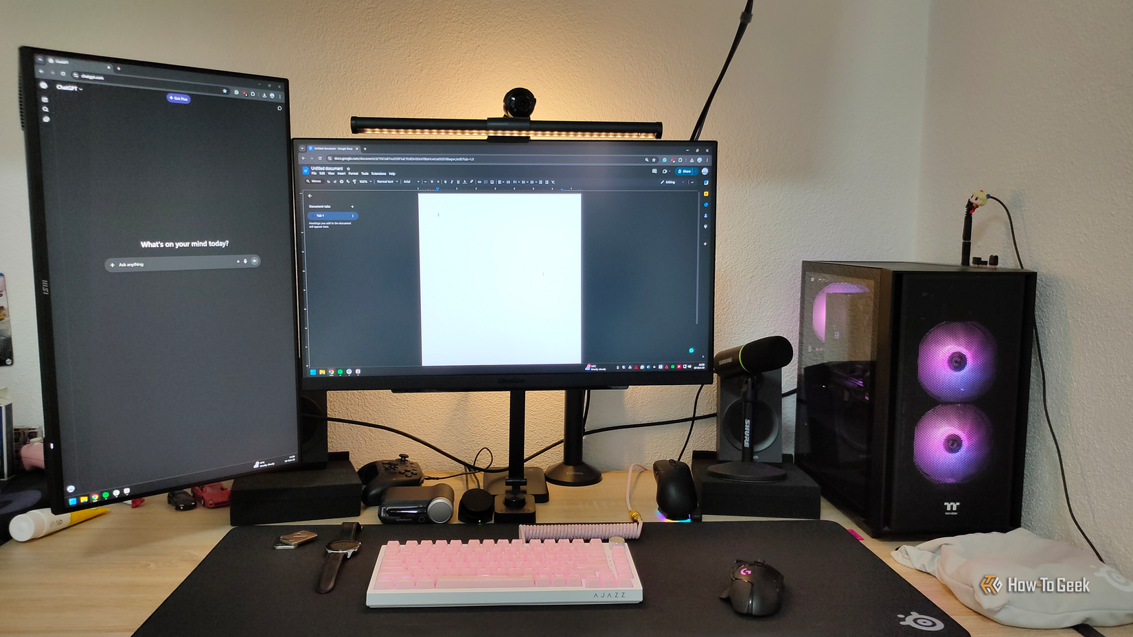 A desktop computer setup for work with a main monitor and secondary vertical monitor.