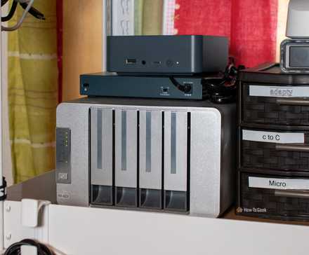 A Beelink mini PC and Terramaster NAS together on a shelf.