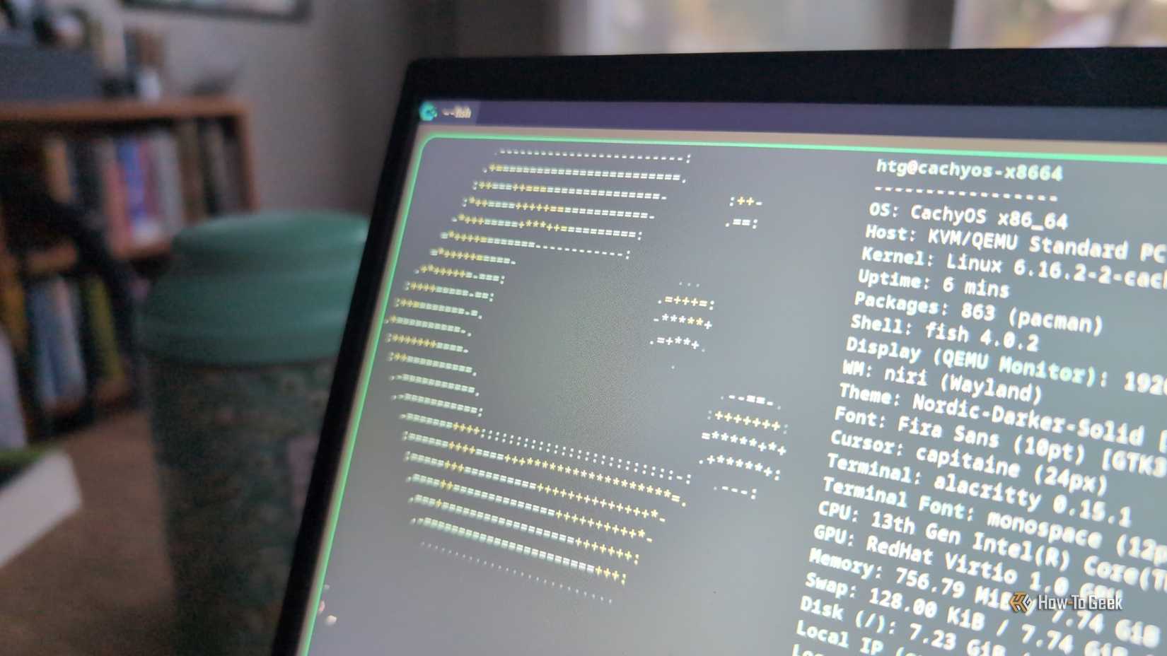 A laptop screen with the CachyOS logo showing in a Linux terminal.