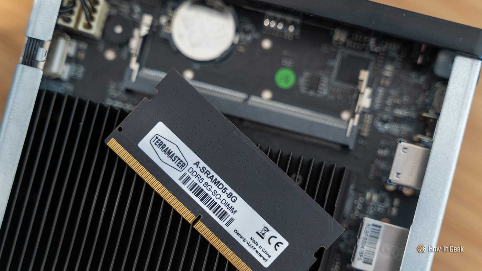 The DDR5 RAM module removed from the TeraMaster F4 SSD NAS to show that it's upgradable.