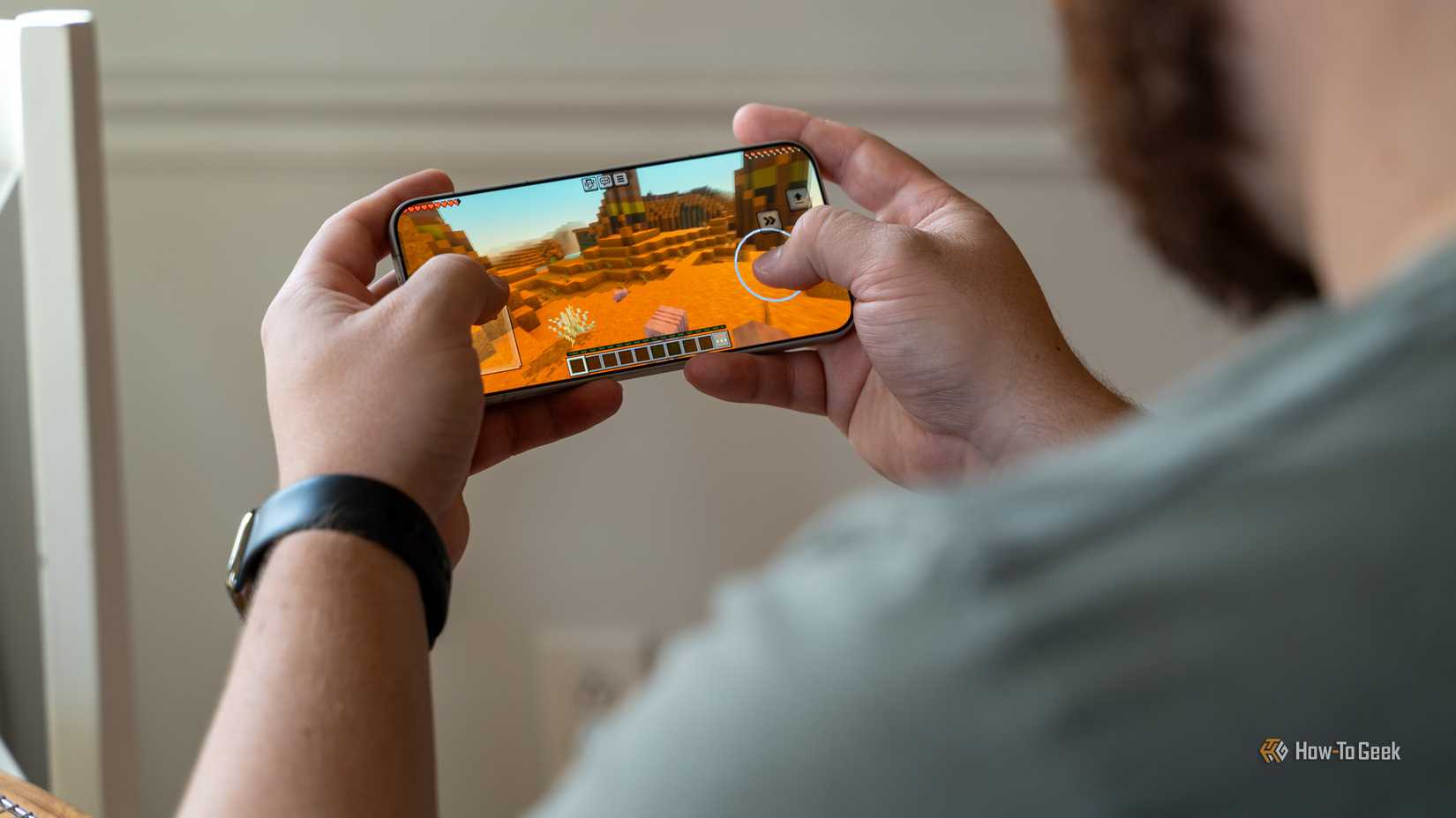 A person playing Minecraft on the OnePlus 15.
