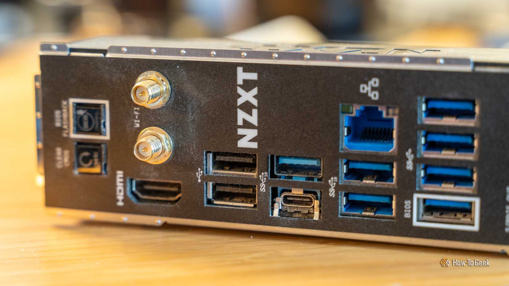 The rear I/O of a NZXT motherboard, showing nine USB-A ports and just one USB-C port.