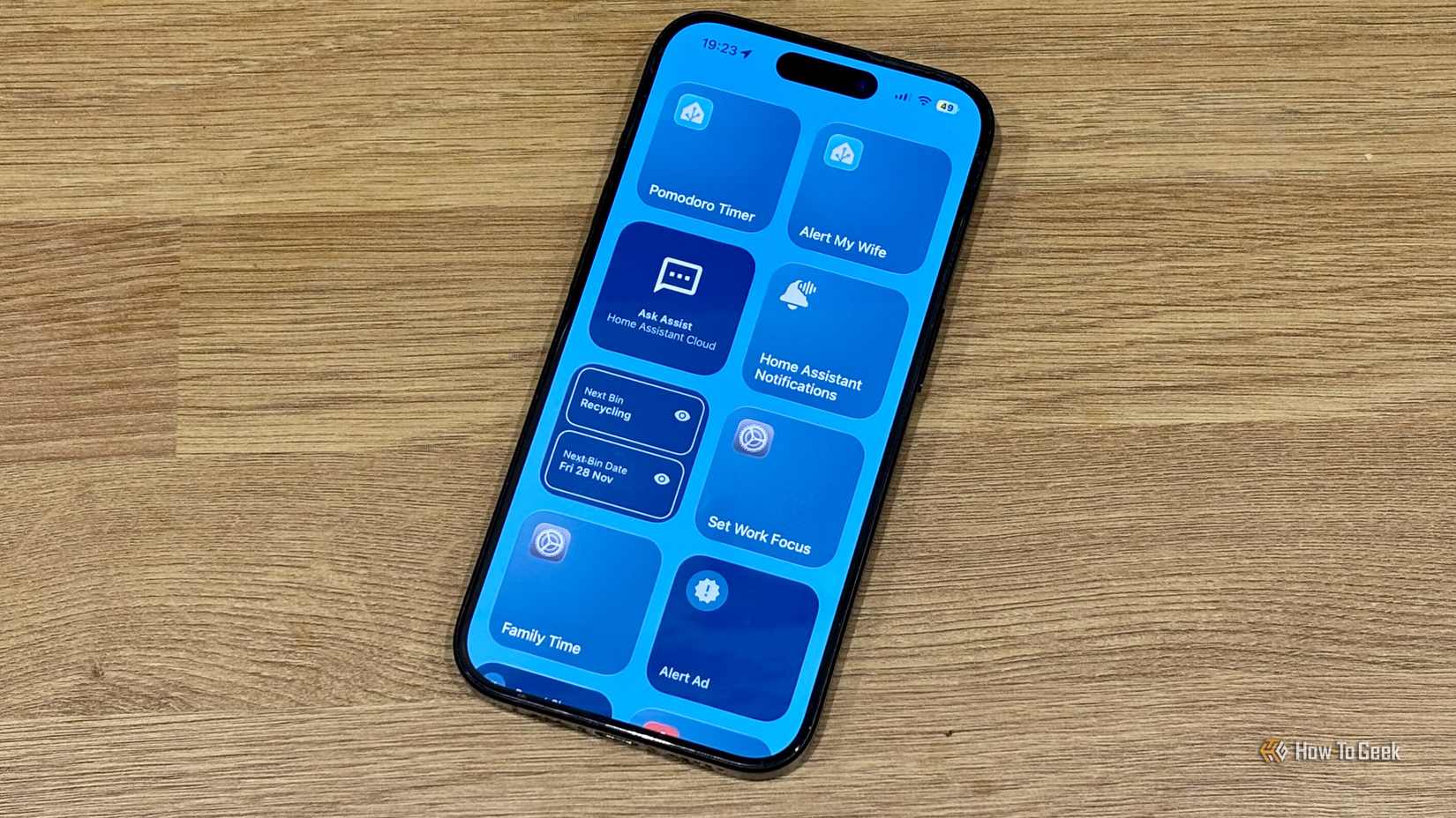An iPhone on the Today View showing multiple Home Assistant widgets.