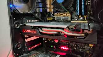 An old AMD RX 580 inside of a dusty old gaming pc.