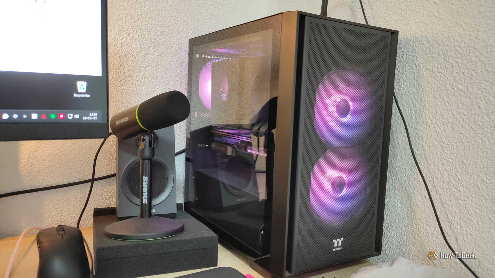 A gaming PC and a microphone next to it.
