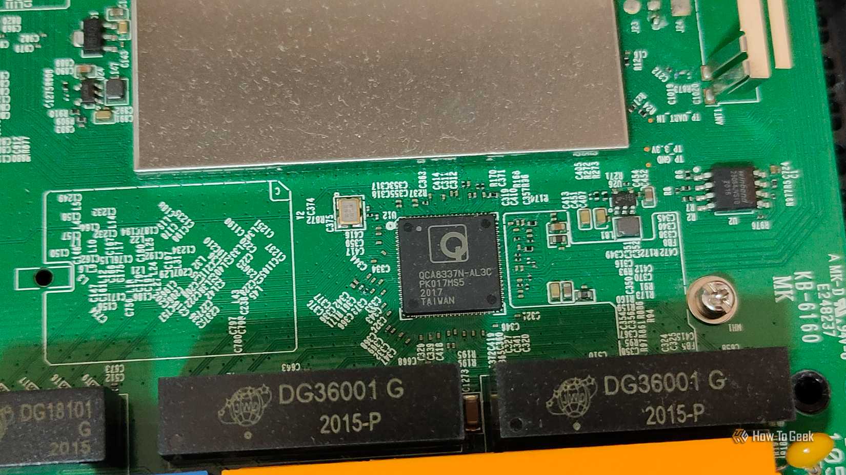 A close-up of a Qualcomm ethernet switch chip on a PCB.