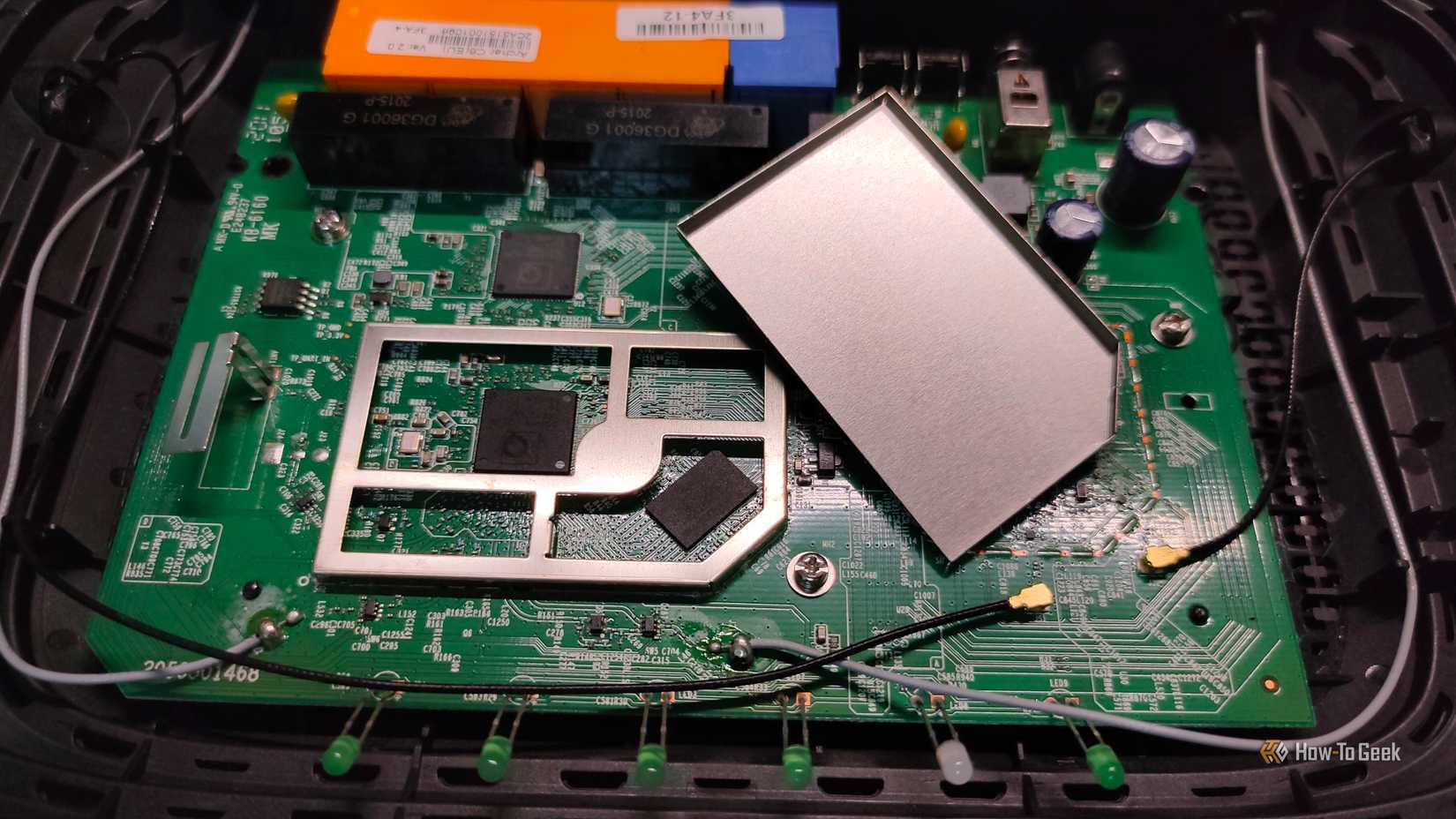 An SoC and RAM of a Wi-Fi router.