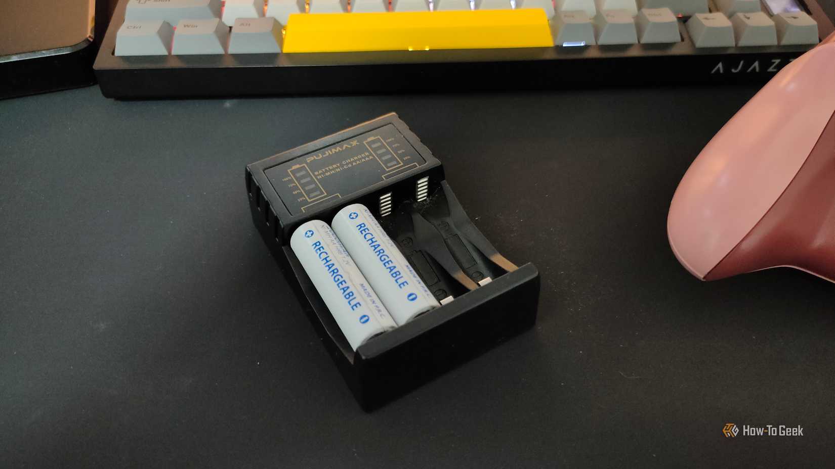 NiMH batteries being recharged in a charger.