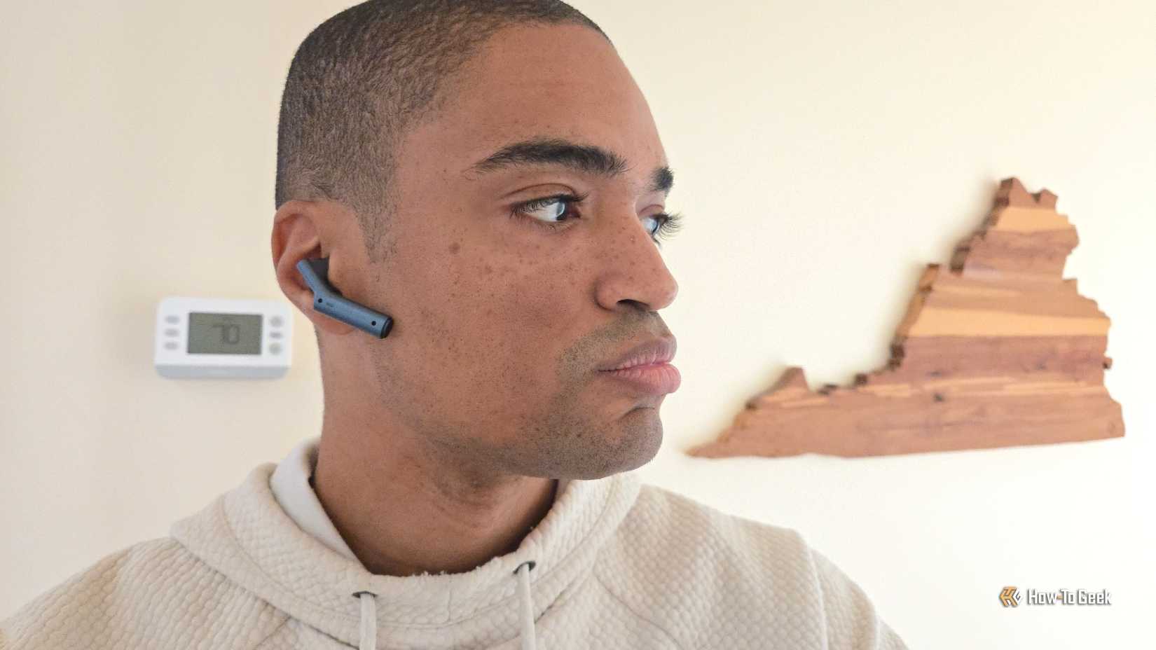 Person wearing a Timekettle W4 earbud