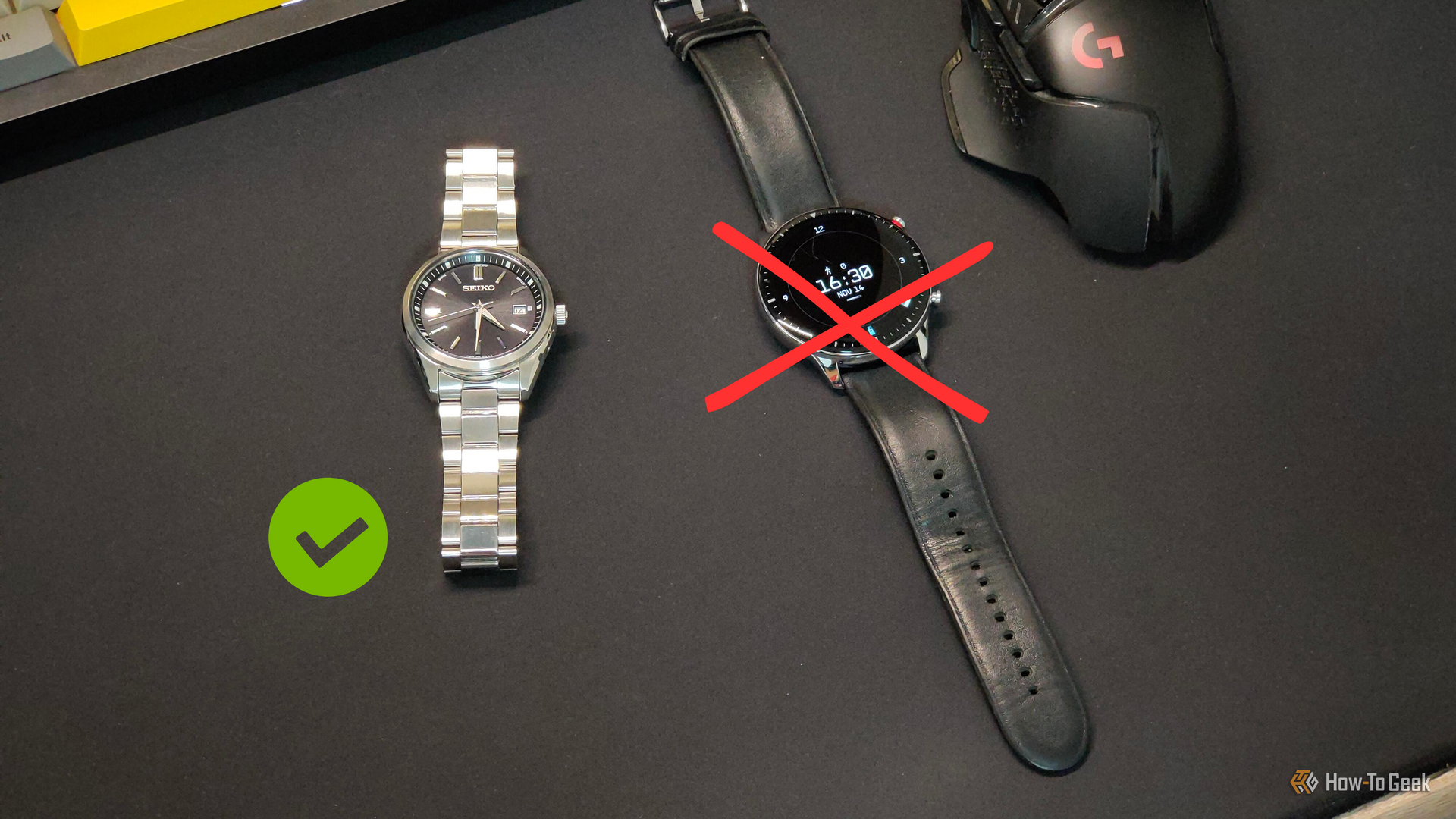 A regular watch next to a smartwatch that's been crossed out with a red cross.