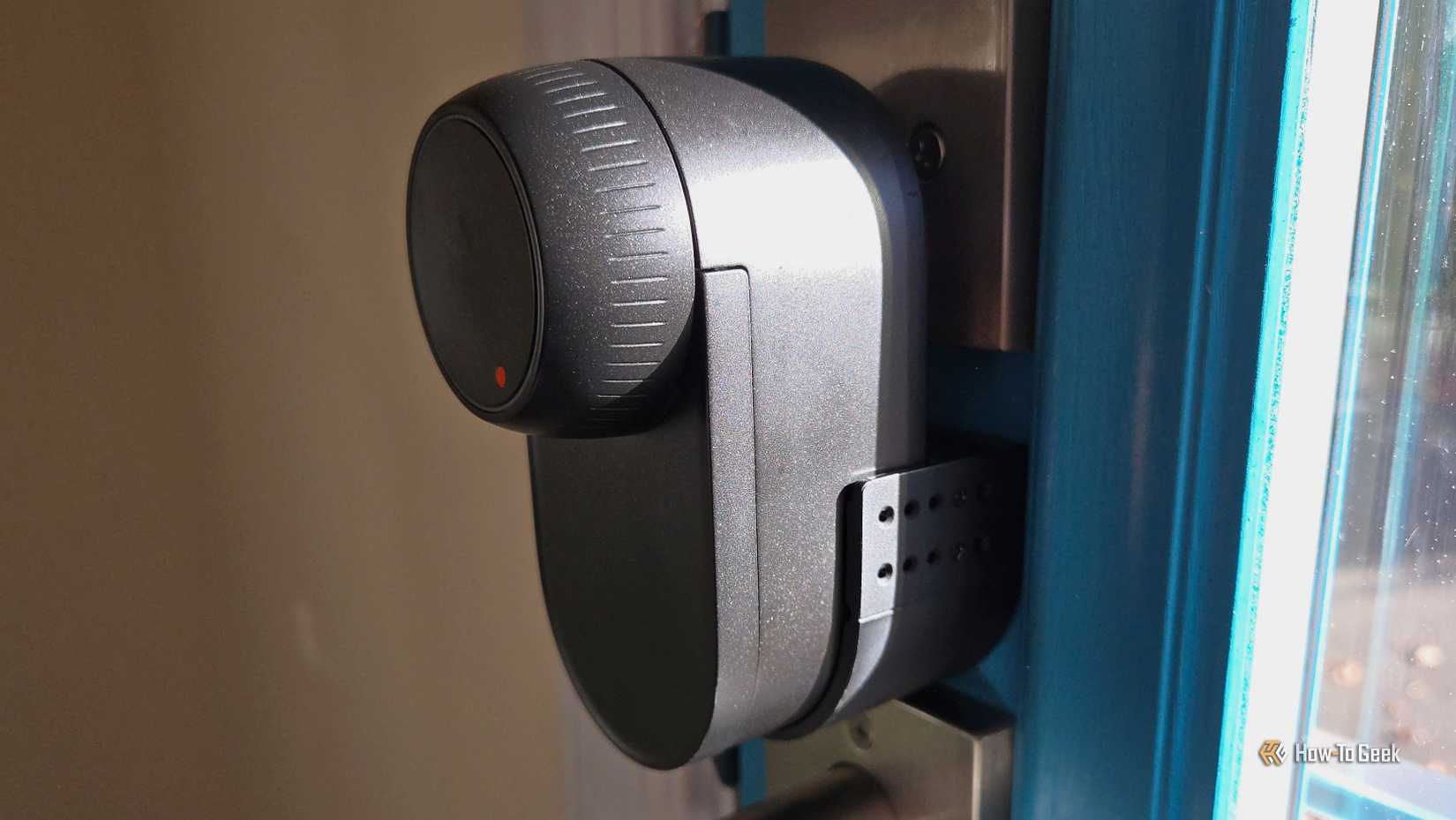 SwitchBot Lock Ultra on a blue door.