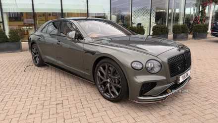 Static front 3/4 shot of a gray 2026 Bentley Flying Spur Speed.