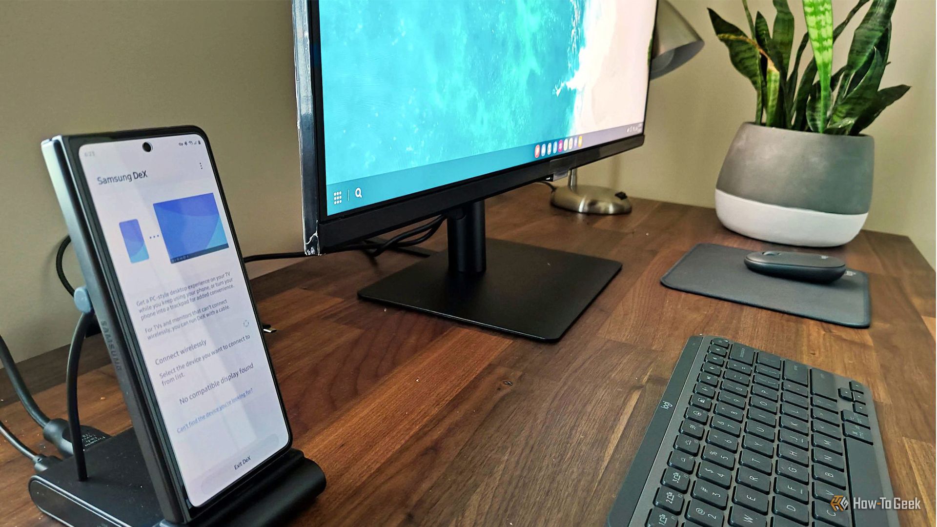 A Samsung phone connected to a desktop computer monitor.