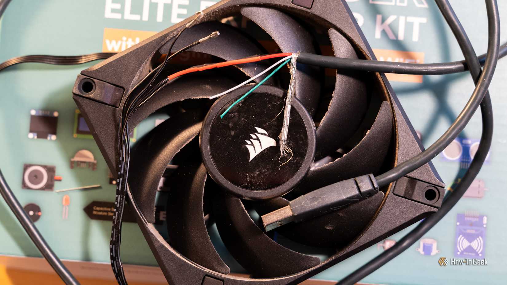 A CORSAIR PC fan that has been spliced into a USB cable.