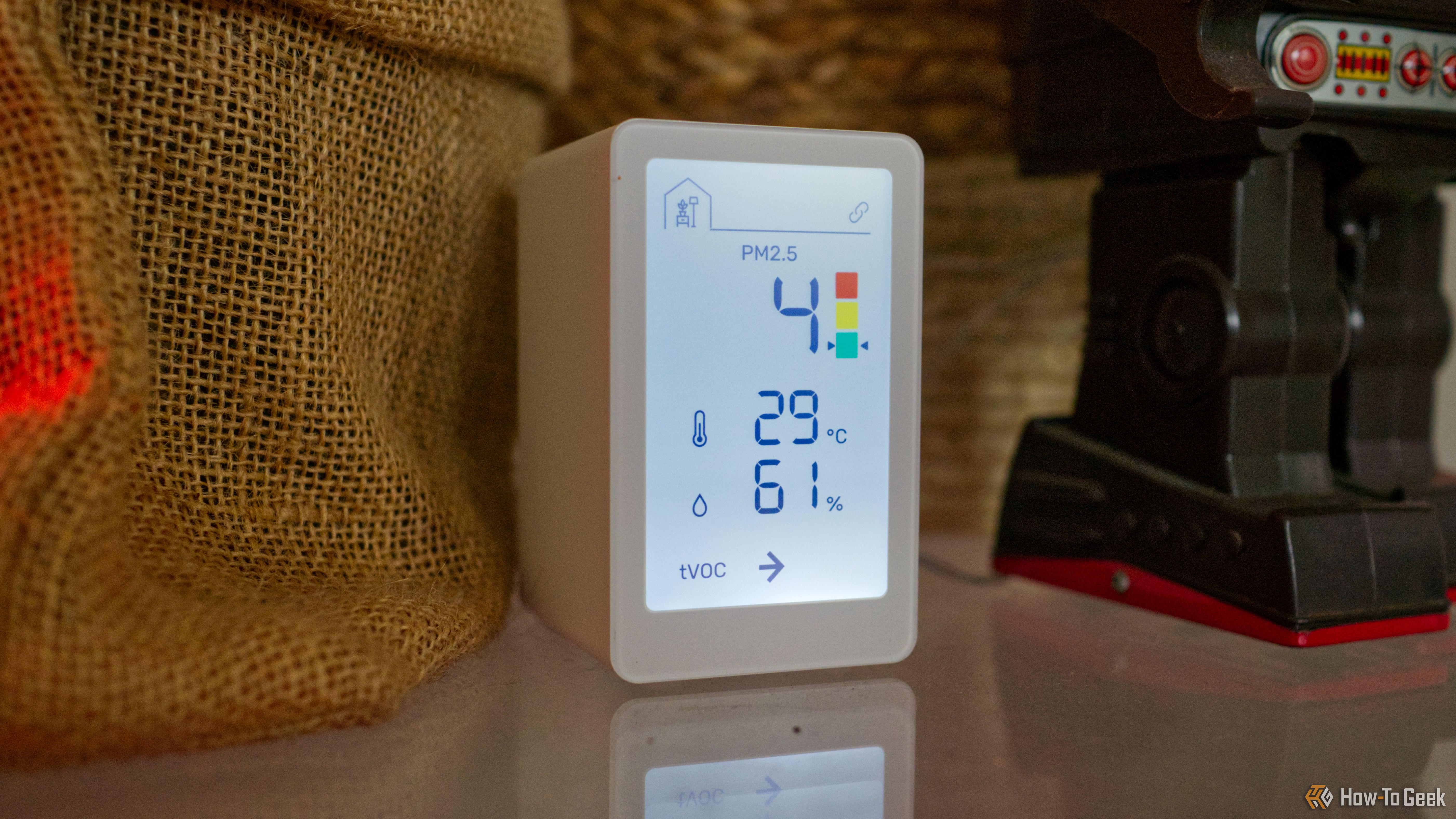 IKEA Vindstyrka air quality monitor on a table.
