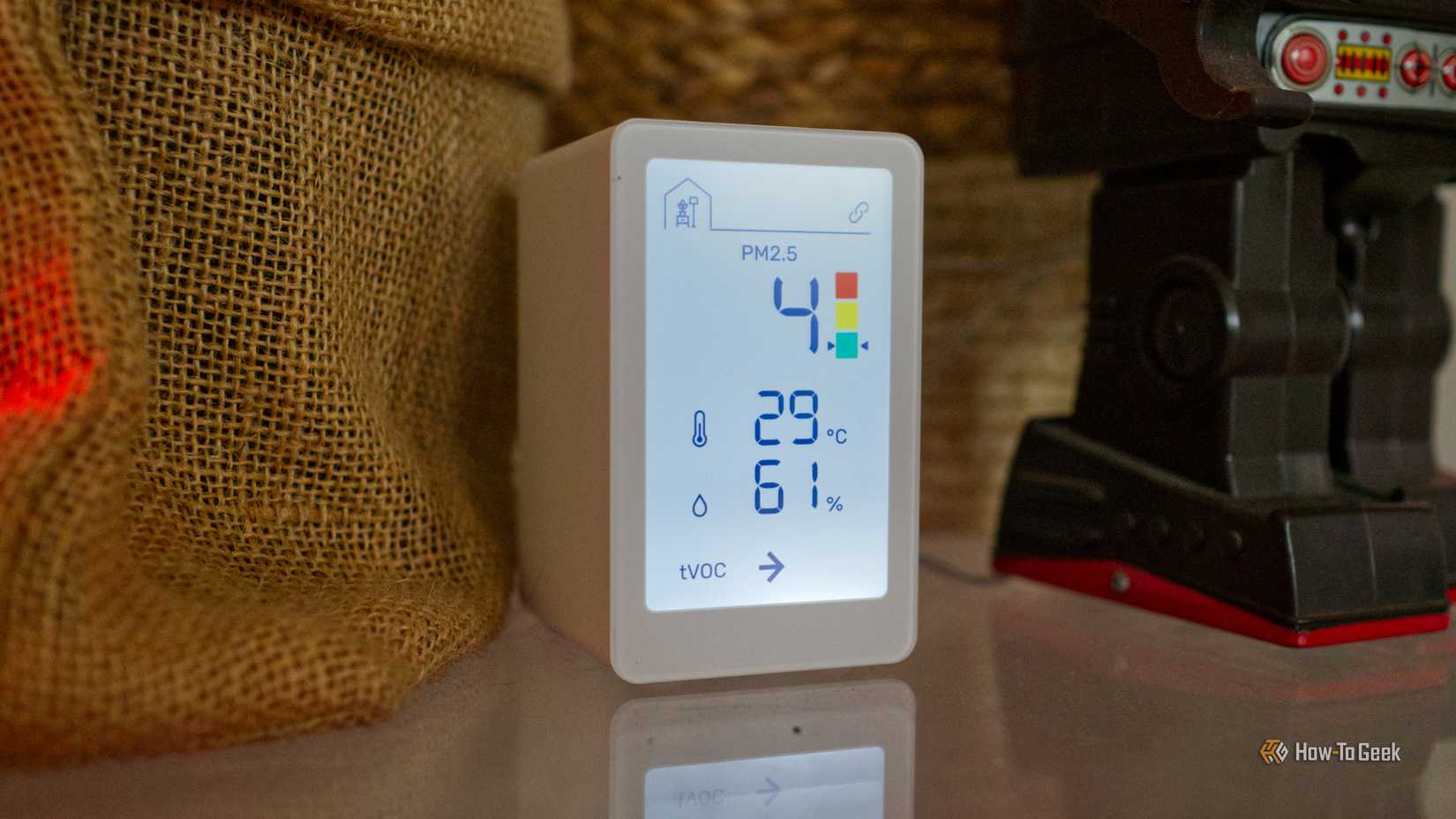 IKEA Vindstyrka air quality monitor on a table.