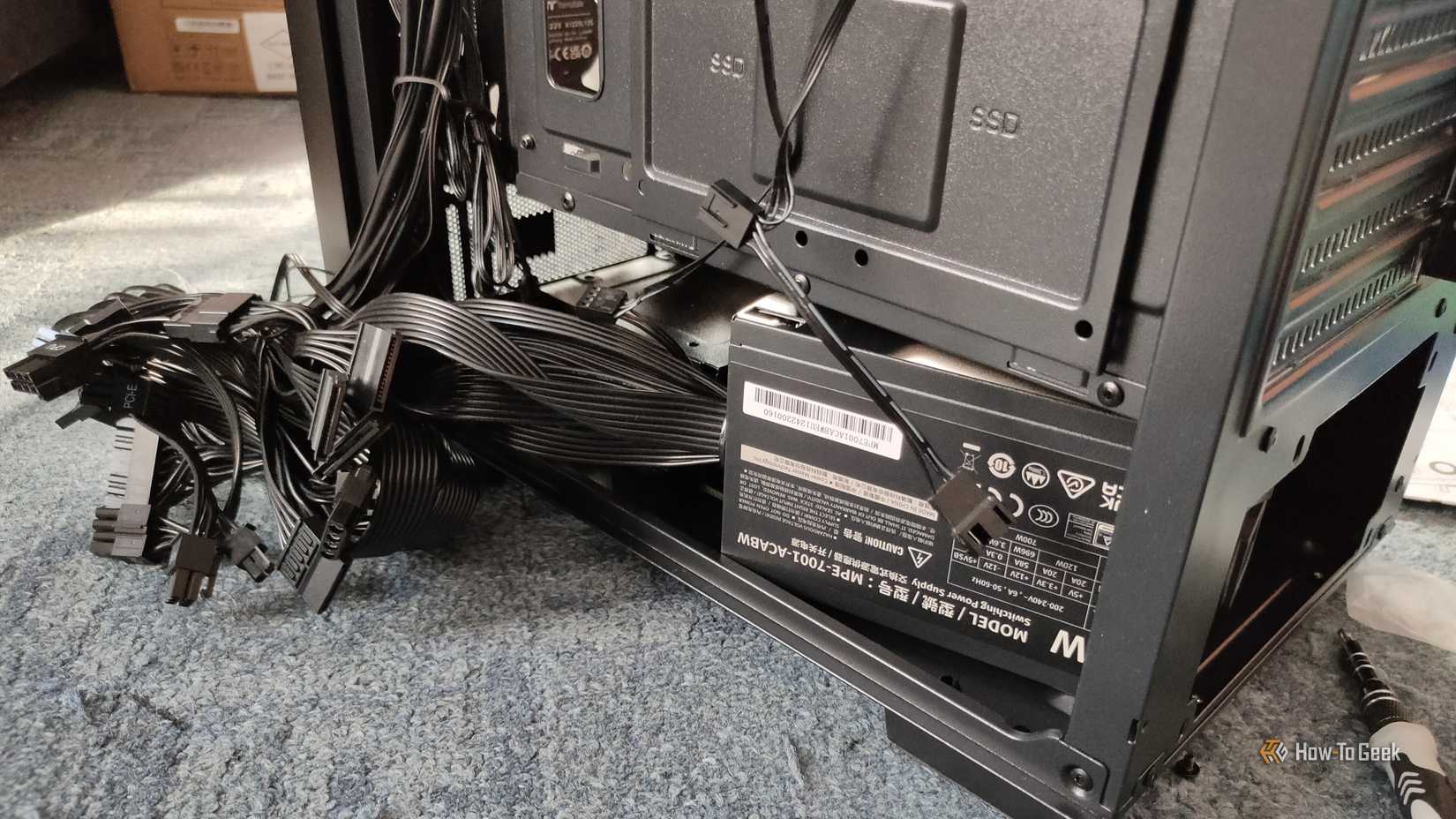 A power supply with a bunch fo cables sticking out.