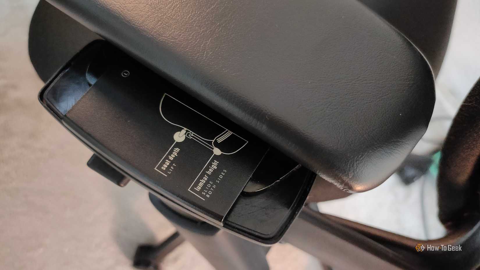 The armrest of a Steelcase Leap V2 ergonomic office chair.