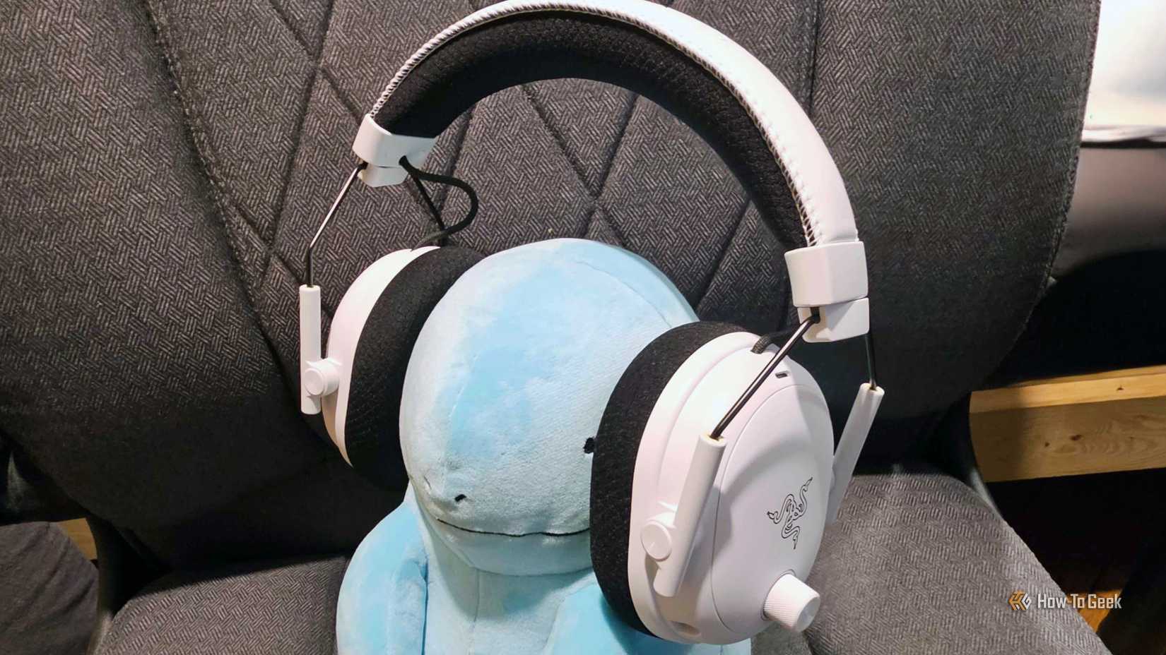 Razer BlackShark V3 Pro headset on Pokemon Quagsire plush.