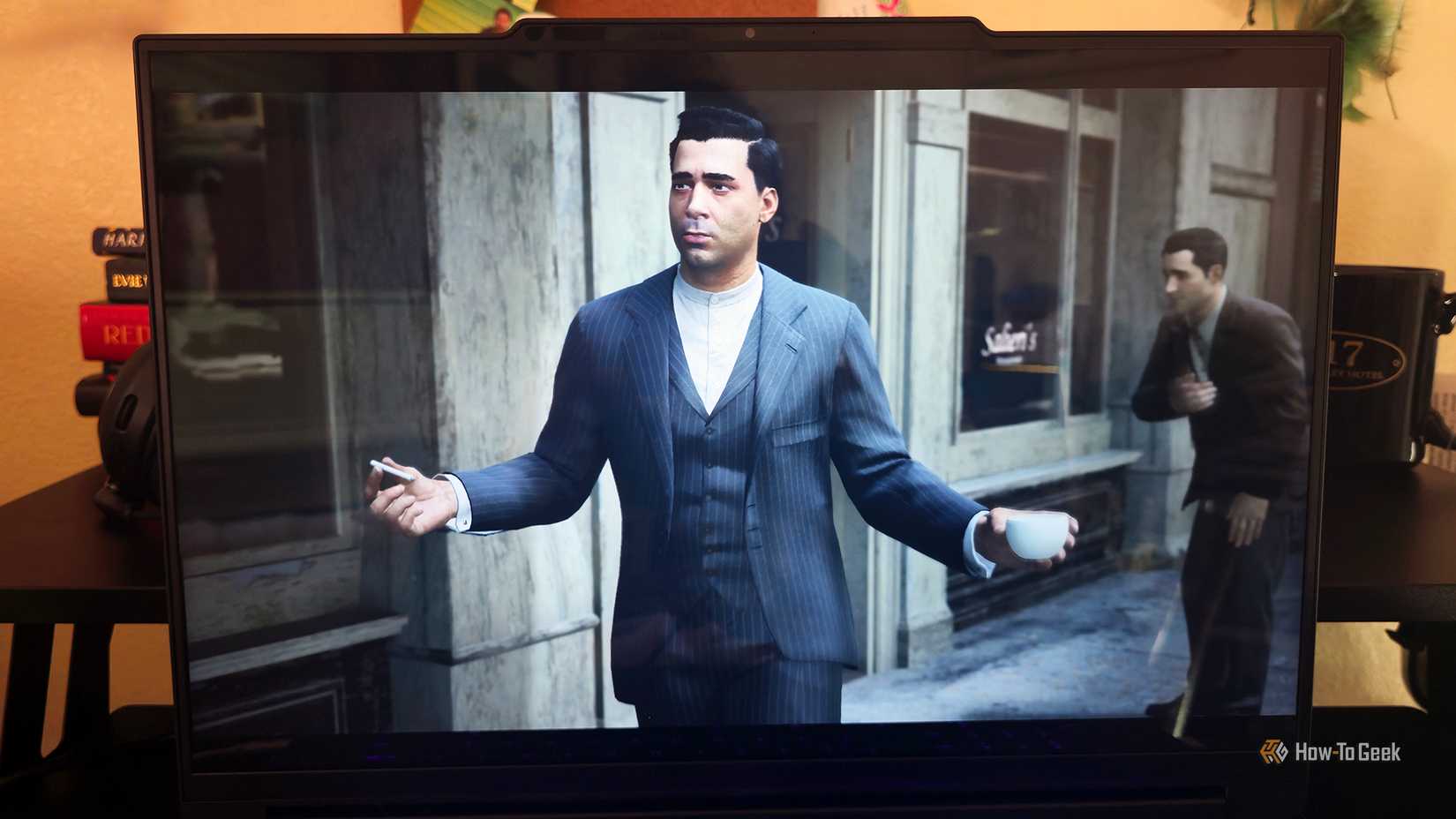 O laptop para jogos Lenovo Legion 9i Gen 10 apresentando o jogo ‘Mafia Definitive Edition’.