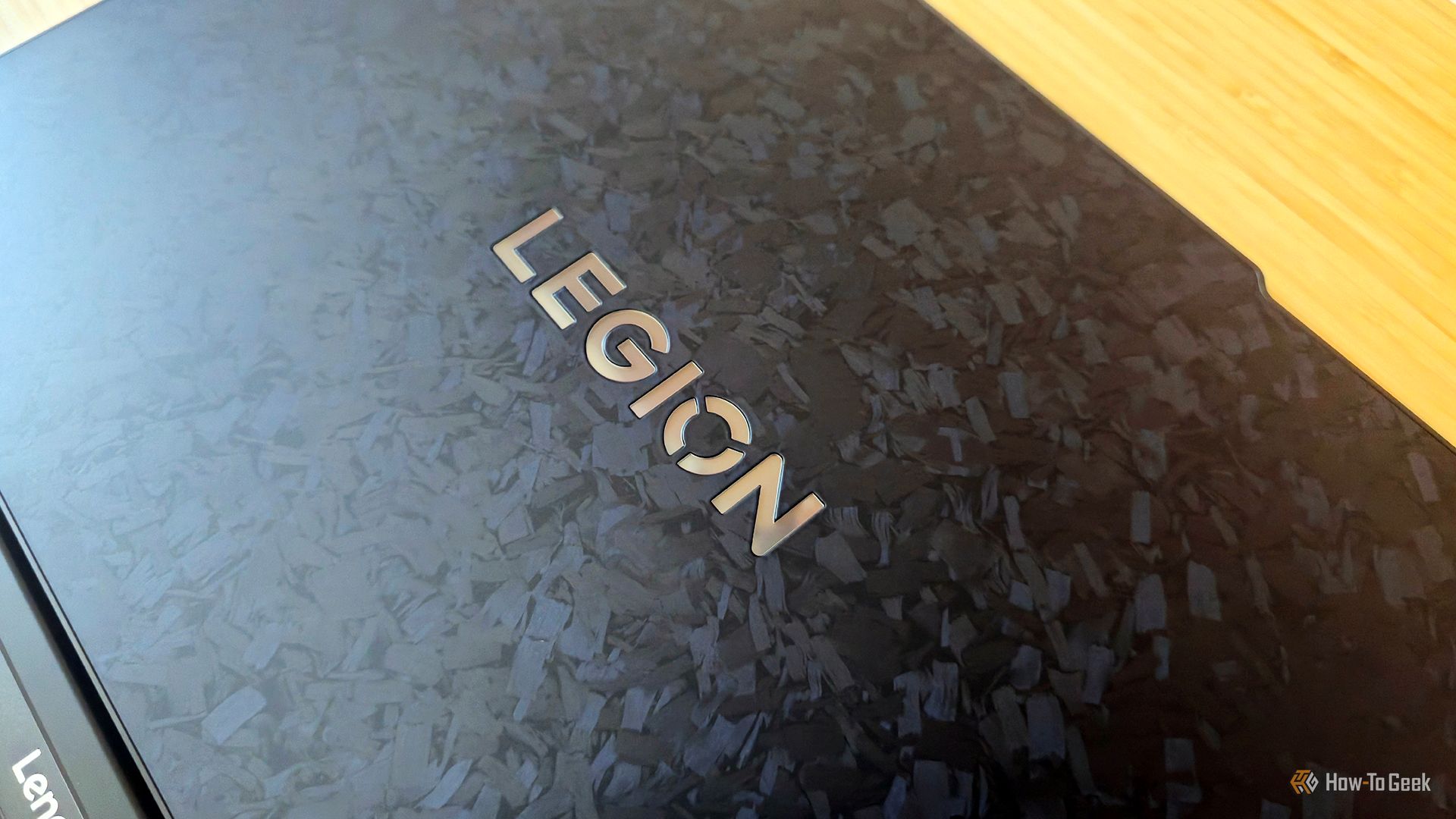 The Lenovo Legion 9i Gen 10 gaming laptop's carbon fiber lid and logo.