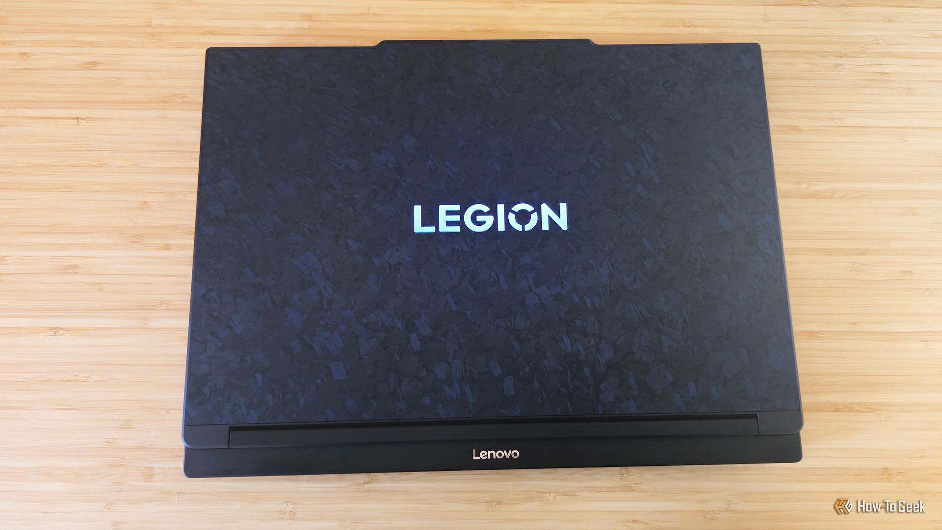 The Lenovo Legion 9i Gen 10 gaming laptop sitting closed on a desk.
