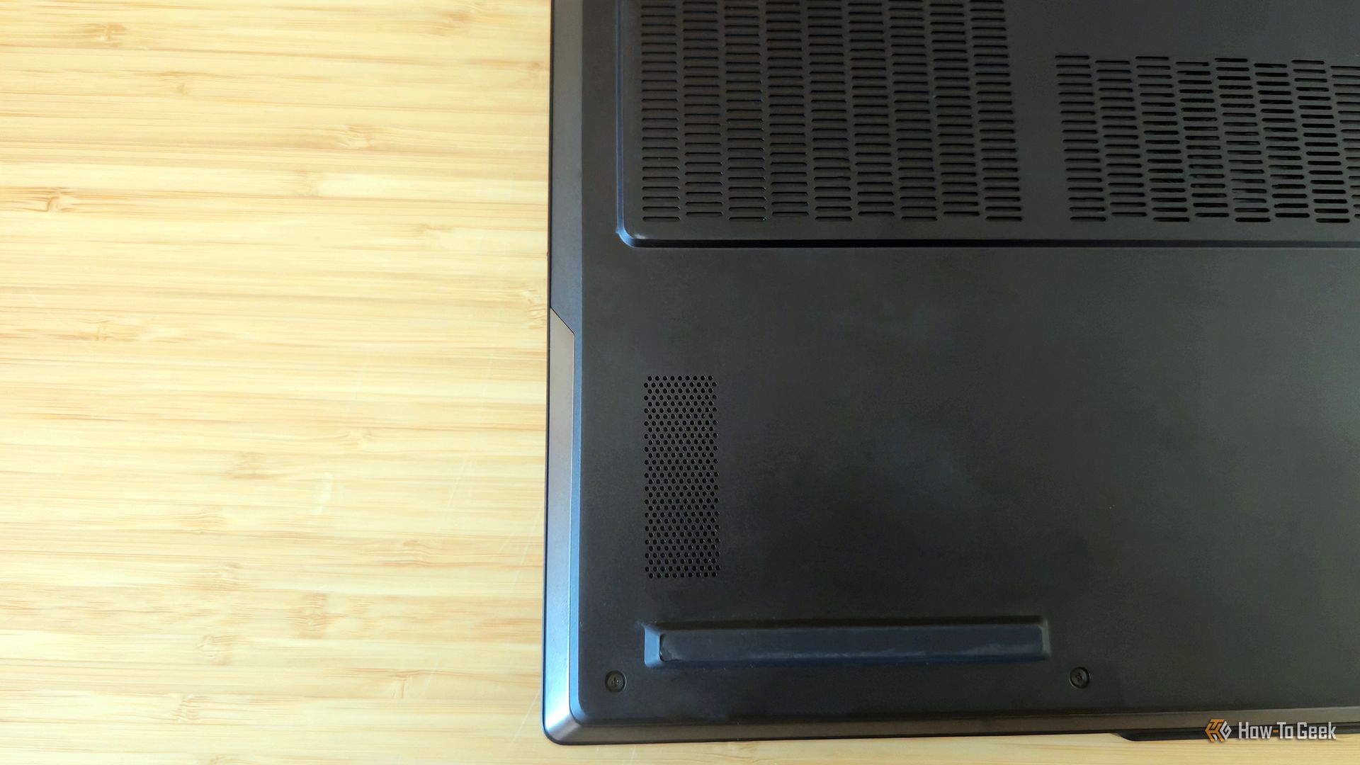 The ventilation and speaker on the bottom of the Lenovo Legion 9i Gen 10 gaming laptop.