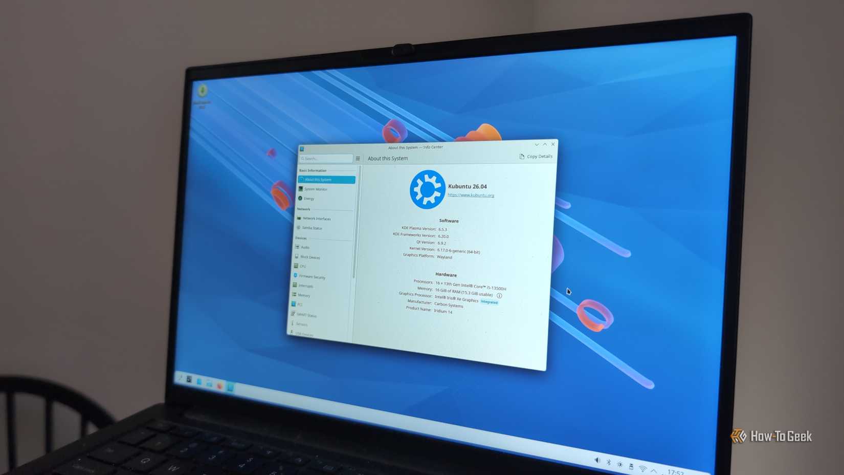 A snapshot version of Kubuntu 26.04 Resolute Raccoon on a laptop screen.