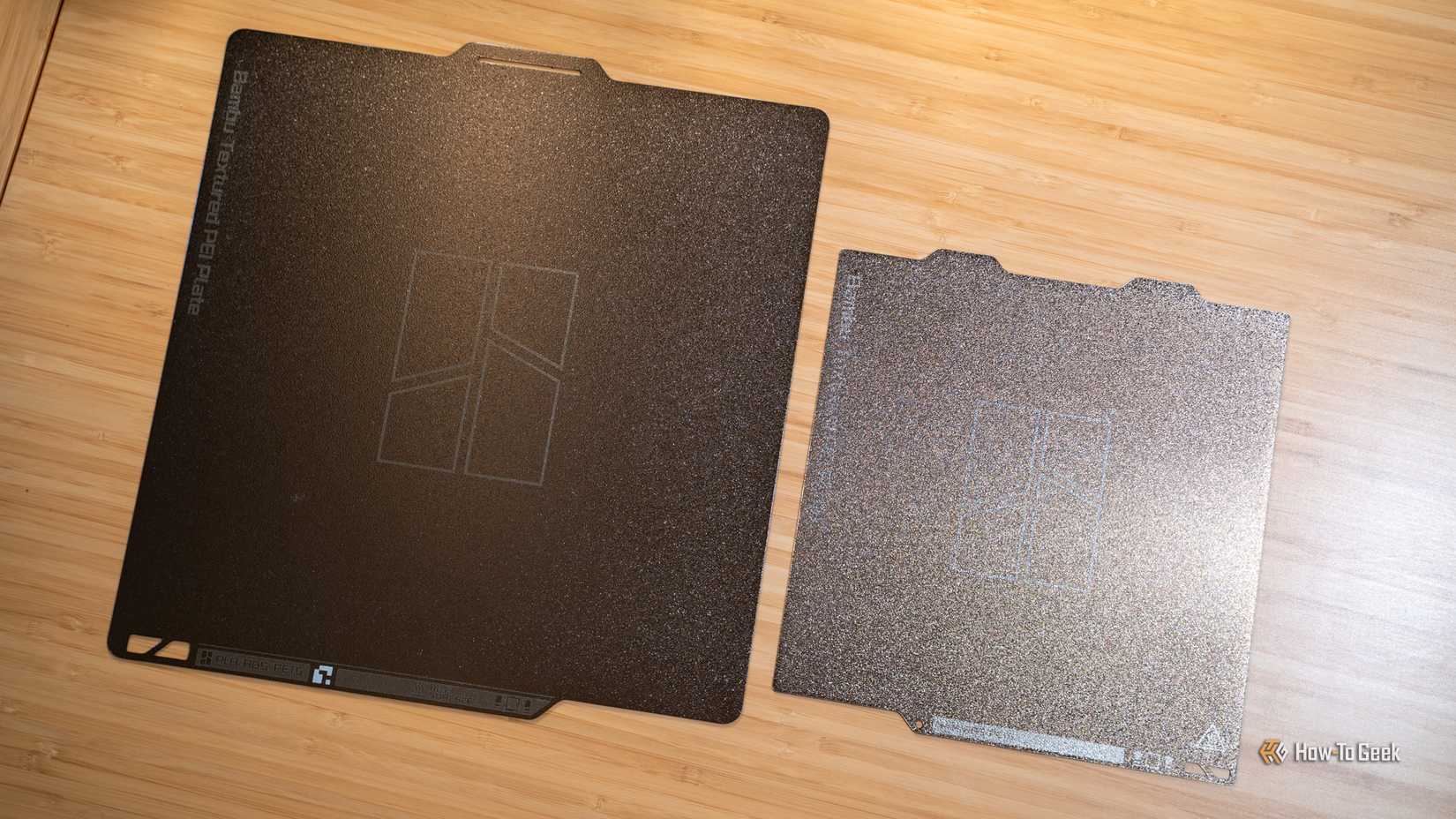 The Bambu Lab A1 mini build plate next to the Bambu Lab P2S build plate.