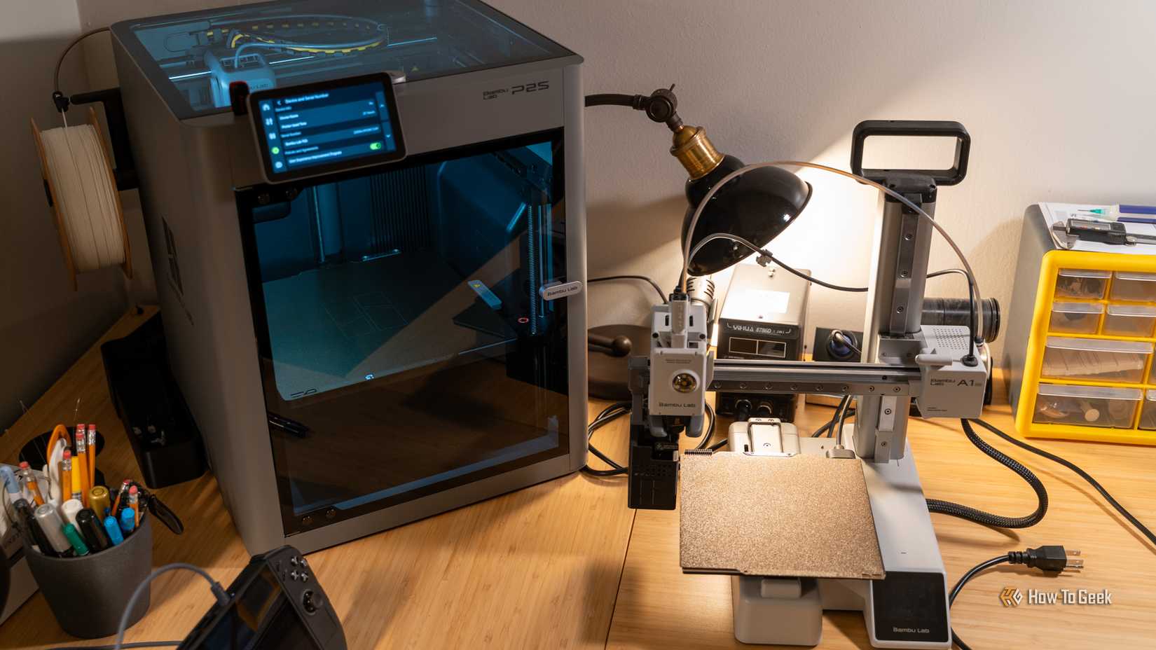 A Bambu Lab P2S sitting next to a Bambu Lab A1 mini.