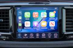 Apple CarPlay app screen showing a fixed row of apps that has to be swiped through.