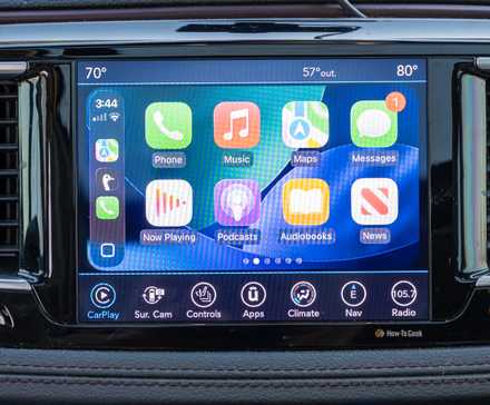 Apple CarPlay app screen showing a fixed row of apps that has to be swiped through.