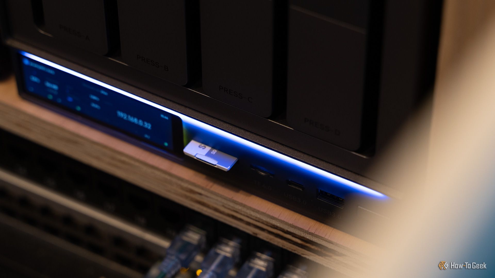 An SD card plugged into the front of the Zettlab D4 NAS.