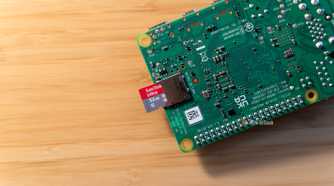 A 32GB microSD card halfway inserted into a Raspberry Pi 4b.