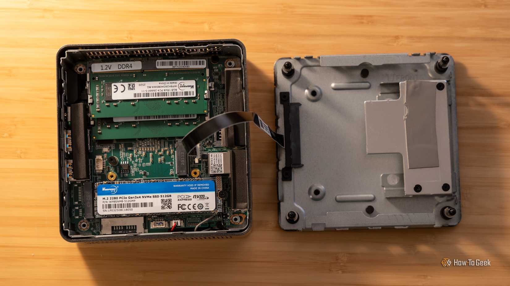 The inside of the GEEKOM A5 mini PC showing user-replaceable RAM and SSDs.