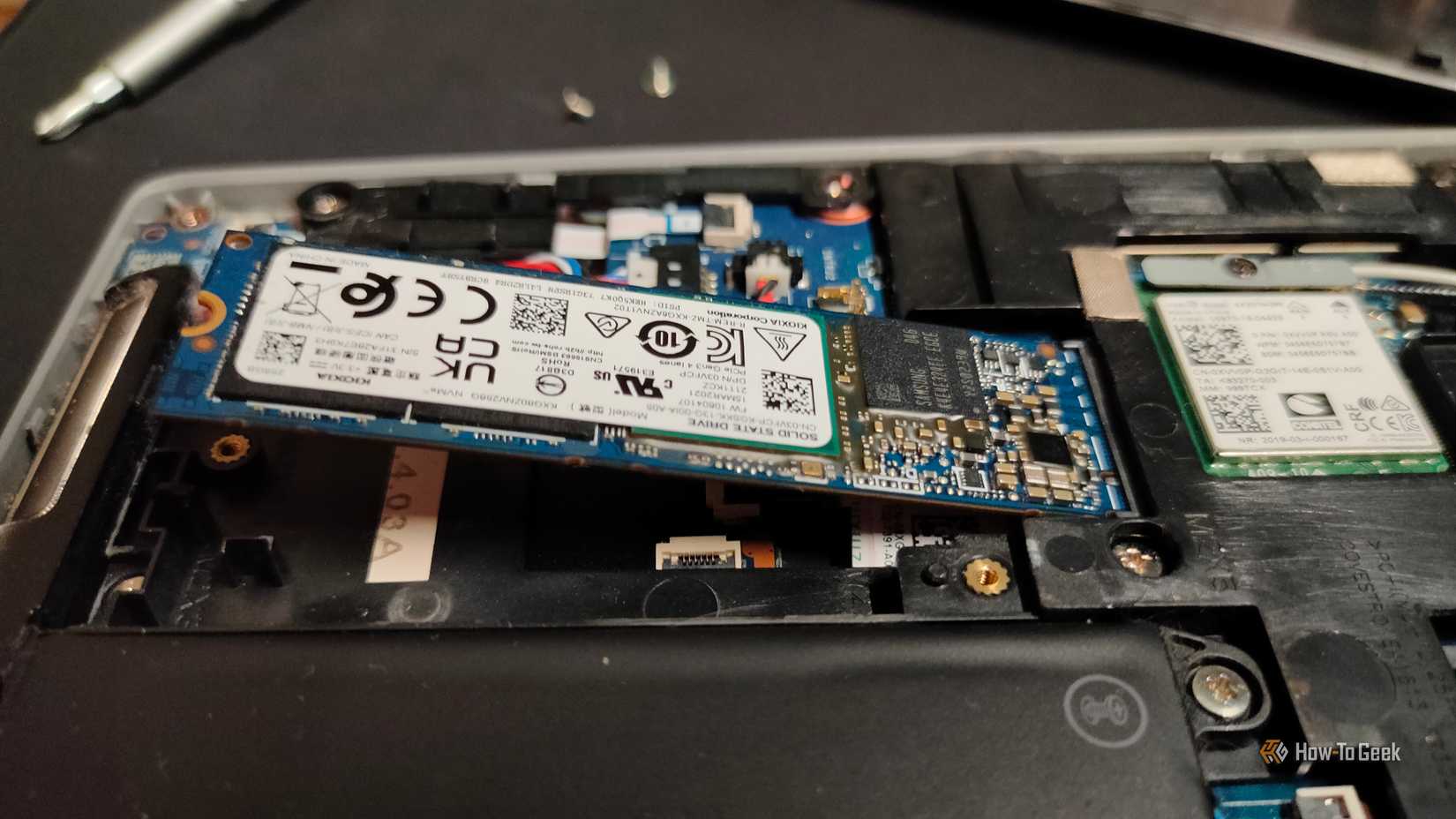 An NVMe at a 30-degree angle inside of an M.2 slot in a laptop.