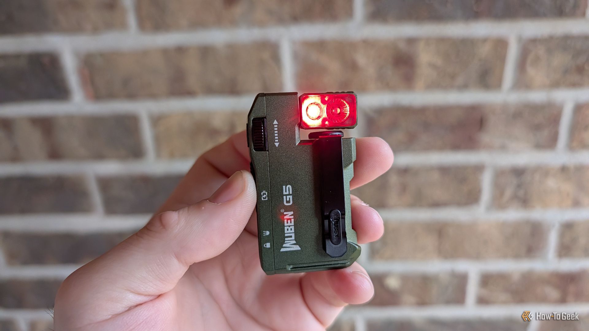 Wuben G5 flashlight with the secondary LED blinking red. 
