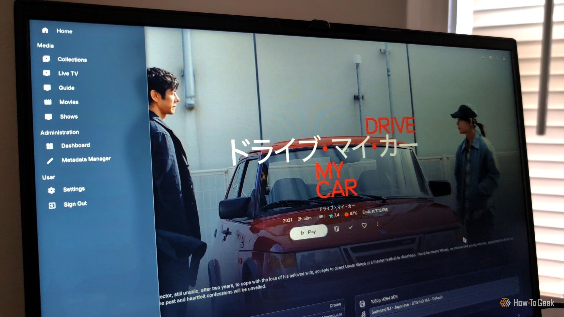 A laptop screen showing the movie Drive My Car in a Jellyfin web interface with ElegantFin theme applied.