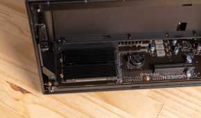 A wide view of the Ugreen iDX6011 Pro NAS motherboard with the M.2 heatsink installed and PCIe slot visible.