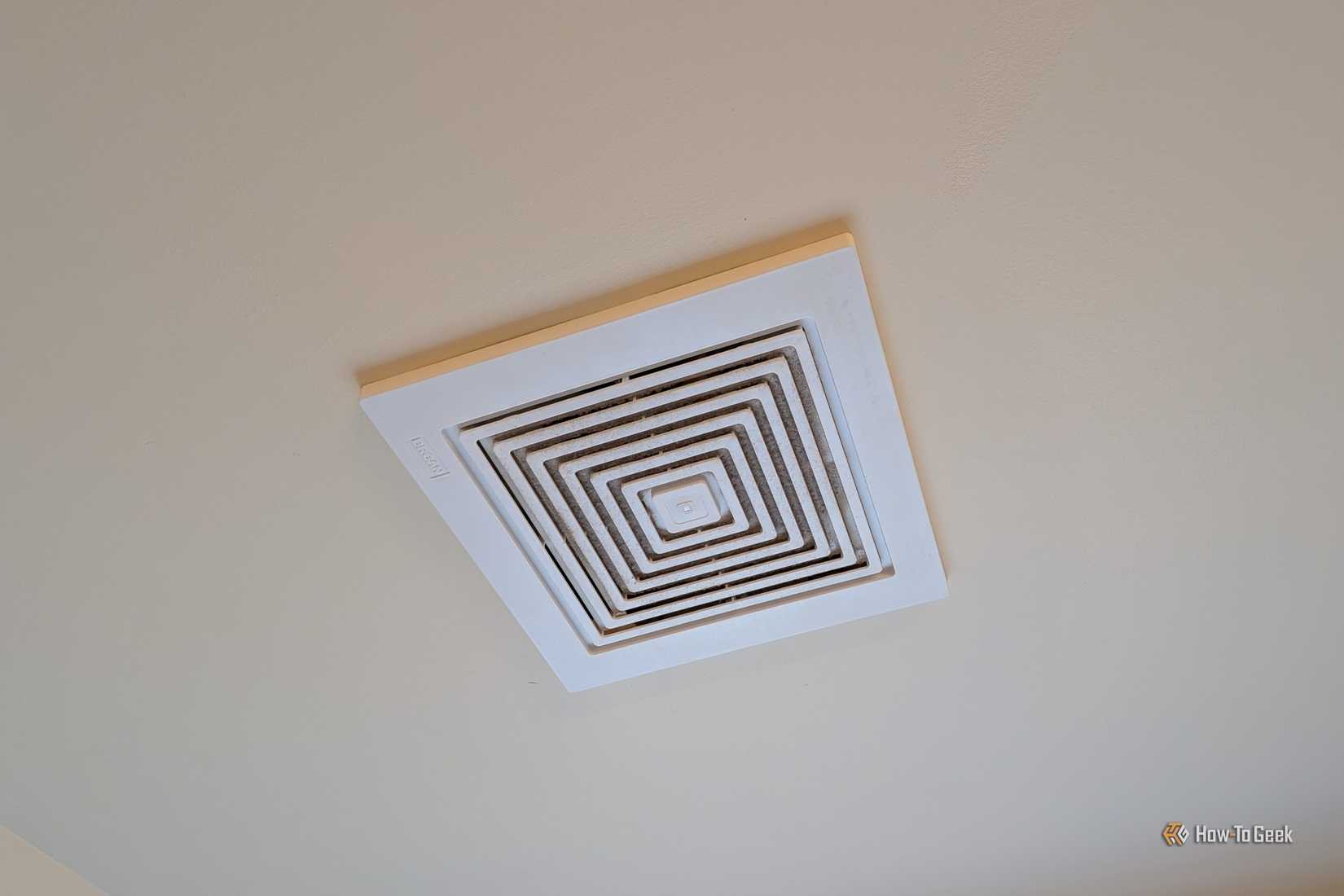 An exhaust fan in a bathroom ceiling.